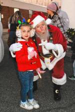 <b>Olivia Kopala of Newton poses with Santa at the Festival of Lights celebration Saturday, Nov. 16 at the Newton Medical Center. (Photo by Maria Kovic)</b>