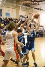 Sparta's Finnegan Mell (22) tries for a basket. In front of him is Sparta's Matthew Maresca (11). Mell scored 12 points and Maresca had nine points in the finals. (Photos by John Hester)