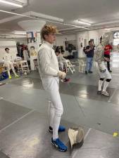 Senior Allen Trudnos competes in saber for the Pope John fencing team.