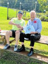 <b>Bill Truran, left, and Bob Nicholson at the picnic table. (Photo courtesy of Bill Truran)</b>