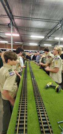 Boy Scouts help set up a model train to be displayed at the German Christmas Market this weekend at the Sussex County Fairgrounds. (Photos courtesy of Jim Hofmann)