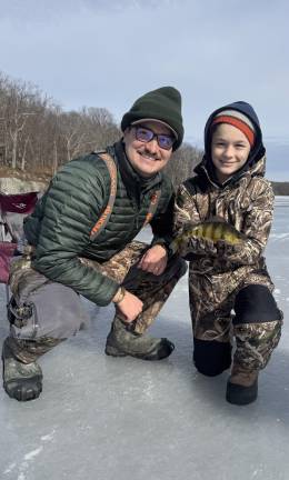 Goshen resident Perry Troisi ice fishing with his nephew in Orange County, N.Y.