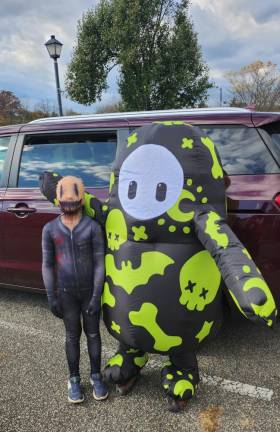 Andrew Woodbury, 7, is dressed as Mr. Smile and Lucas Woodbury, 10, is Fall Guy.