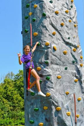 Alanna Bileci of Newton on the rock tower.