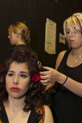 Danielle Miserendino of Lafayette gets last minute hair and makeup adjustments before the fashion show.