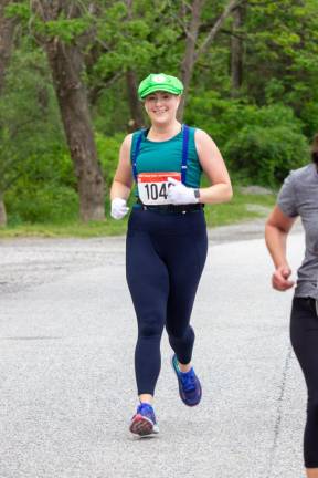 Whitney Fors of Vernon crosses the finish line.