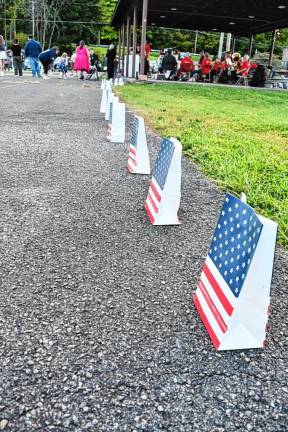 Luminaries line the walkway.