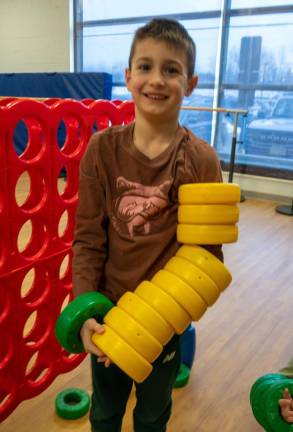 Wylan Begley gets ready to play Connect 4.