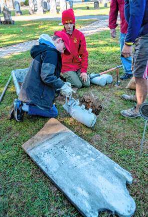 RW4 Blaise and Xavier Franko repair a gravestone.