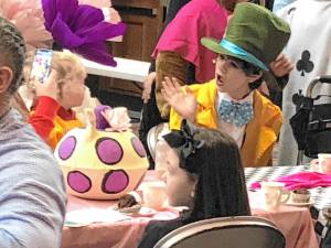 The Mad Hatter greets a guest at the Mad Hatter’s Tea Party on Saturday, Jan. 18 in the Sparta High School auditorium. The event was a meet and greet as well as a performance by the cast of the middle school musical ‘Alice in Wonderland Jr.’<b> </b>(Photos by Kathy Shwiff)