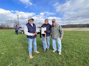 Bruce Tomlinson, Bill Kovach and Ned Miller prepare the course for the Chili Open at the Sussex County Fairgrounds. (Photo courtesy of Project Self-Sufficiency)