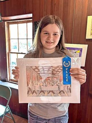 Eighth-grader Cassidy Lairson, who won first place for her artwork, ‘The Cat Supper.’