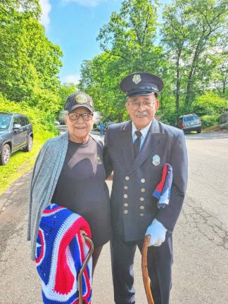 OG3 Rosemary and Joseph Mora receive a blanket for their service in the armed forces.