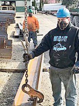 Workers at R.S. Phillips Steel in Vernon wear handmade face masks donated by the Vernon Township Woman’s Club.