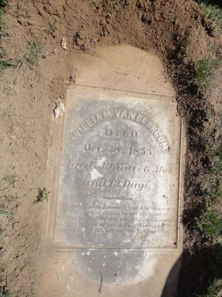 The recently unearthed grave marker of William Van Blarcum, which has been hidden under about four inches of sod and soil since the early 1900s.