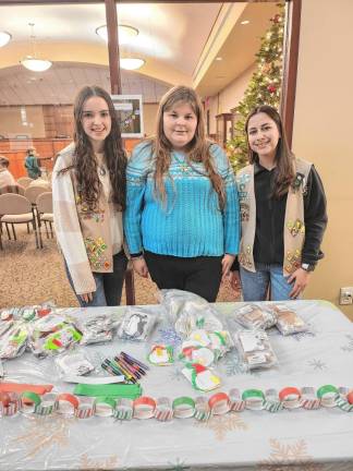 Wallkill Valley Girl Scouts, from left, are Cara Masino, Brooke Jensen and Nicole Wasniowska. The event includes hot chocolate and cookies as well as holiday crafts.