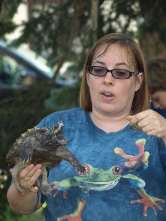 Dawn Masino, with Rizzo' Reptile Discovery, explains the feeding habits of an alligator snapping turtle.