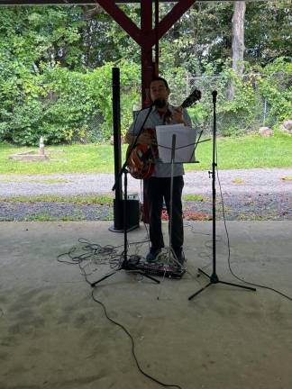 PC3 Eric Waldman of Peace Farmers entertains during the picnic.