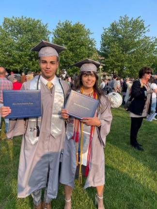 Max Masih, 16, and his sister, Sam, 17, hold their diplomas after the Sussex County Community College graduation May 17. (Photos provided)