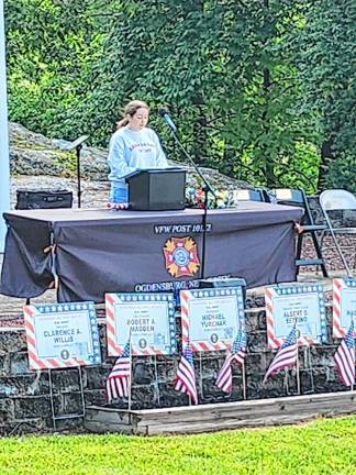 OG4 Bailee Gandarinho reads an order by Army Commander John Logan to observe Memorial Day on May 30, 1868.