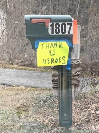 A sign taped to a mailbox thanks first-responders fighting the Jennings Creek Wildfire in Greenwood Lake, N.Y. (Photo by Kathy Shwiff)