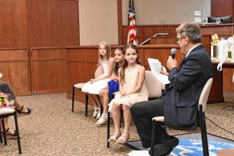 Hardyston Township Councilman Stanley Kula interviews contestants for Junior Miss Hardyston during the pageant Friday, June 7 at the municipal building. (Photos by Maria Kovic)