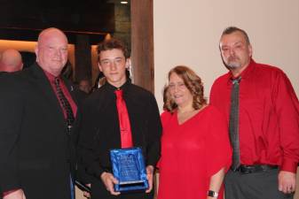 From left are Kevin Danielson with Cody, Heidi and Keith Cooper of Hampton. Cody was honored for performing cardiopulmonary resuscitation on his mother, saving her life. (Photos provided by Louise Gonzalez of Newton Medical Center)