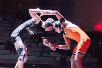 Wallkill Valley's Logan Cicerale, left, and Dover's Brayan Cabrera go head to head in the 144-pound category Jan. 17. Cabrera won by pin. (Photos by George Leroy Hunter)