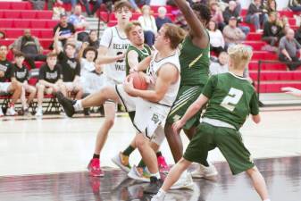 In a game last December against Wyoming Area Secondary Center, Delaware Valley's Lukas Schutz holds the ball after grabbing it during a rebound (Photo by George Leroy Hunter)