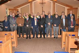 Twelve new members are initiated into the Knights of Columbus Marquette Council 588 on Feb. 23. (Photo provided)