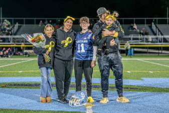 Daniel Bachkhaz at midfield with his mother, Laura; his father, Nart; and his sisters at Sparta High School’s Senior Night on Oct. 25. (Photo courtesy of Laura Bachkhaz)