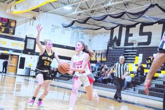 <b>High Point's Kennedy Shepherd moves the ball in the game against West Milford on Thursday, Feb. 27. The Wildcats lost, 42-28, in the first round of the NJSIAA North Jersey, Section 1, Group 2 tournament. (Photo by George Leroy Hunter)</b>