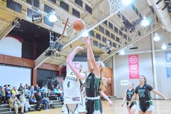 WV1 Wallkill Valley's Kate Fahrenfeld (4) tosses the ball toward the hoop in the game against Veritas Christian Academy on Feb. 13. Veritas won, 50-38, and Fahrenfeld scored 21 points. (Photos by George Leroy Hunter)