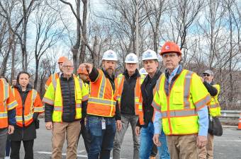 SI1 Gov. Phil Murphy, third from right; U.S. Transportation Secretary Sean Duffy, second from right; and Rep. Tom Kean Jr., right, survey sinkholes on Route 80 on Saturday, March 22. (Photo provided)