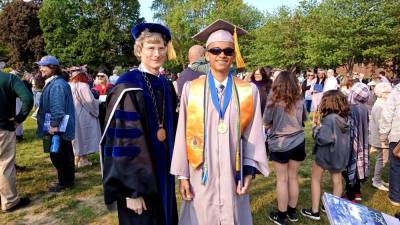 Sussex County Community College president Jon Connolly, left, poses with Ty Lewis, 15, of Hamburg after graduation May 17. Ty earned an associate’s degree in computer science and mathematics. (Photo provided)