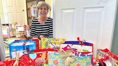 A collection of birthday gift bags is ready to be delivered to residents of the Homestead Rehabilitation and Healthcare Center in Newton by Arleen Hill, co-chair of the Vernon Township Woman’s Club Birthday Bag project (Photo provided)