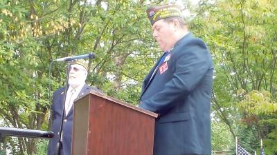 Commander Gregory Protsko addresses the assembly on Patriots Day in Milford, with John Kupillas, Chaplain, VFW Post #8612, on left (Photo by Frances Ruth Harris)