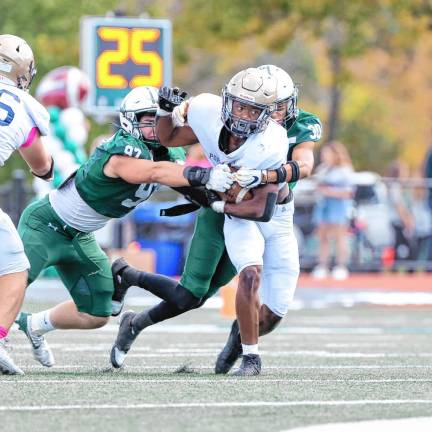 <b>Tylik Hill of Pope John tries to break free on a run in the second quarter.</b>