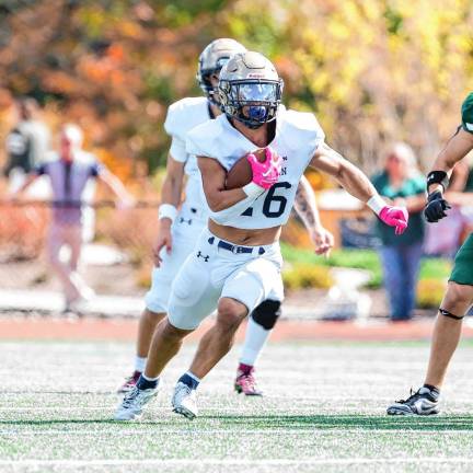 <b>Pope John running back Luke Gialanella cuts to his left through a big hole in the Delbarton defense. He made one touchdown during the game.</b>