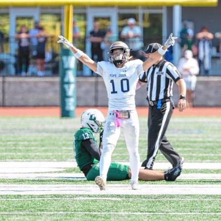 <b>Pope John’s Alex Rakowsky celebrates after breaking up a pass reception by Delbarton’s Girard Yoo in the first quarter. </b>