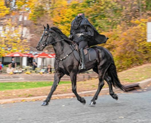 <b>The Headless Horseman rides through Sparta on Halloween. (Photo by Nancy Madacsi)</b>