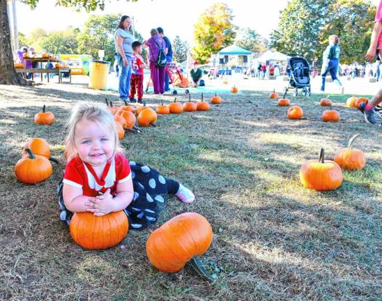 OFF1 Addison Smith poses in the pumpkin patch at the Fall Fest on Saturday, Oct. 19 in Ogdensburg. (Photo by Maria Kovic)