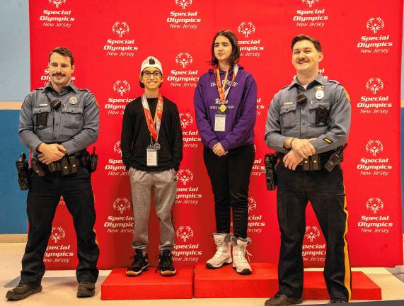 Hardyston Police Officers Jared Kodis, left, and Andrew Reeves, right, with Avery Richardson and Kristina Pkhrikyan.