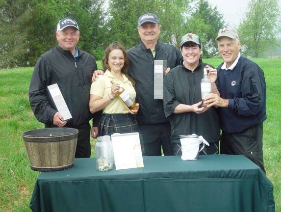 Photo courtesy John Whiting Jack Corcoran, Mark Lomauro, Buffy and John Whiting sample the product at a Mcallan Scotch tasting station on the golf course