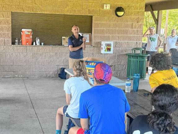 Marcus O’Sullivan, an Irish runner who competed in four Summer Olympics, speaks at the Xtreme Running Camp in Newton.