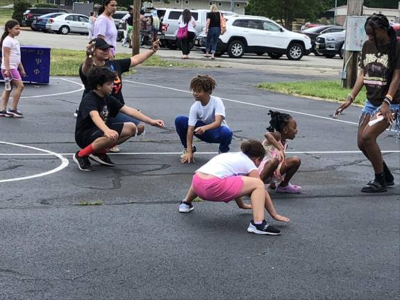 Dancers show how low they can go.