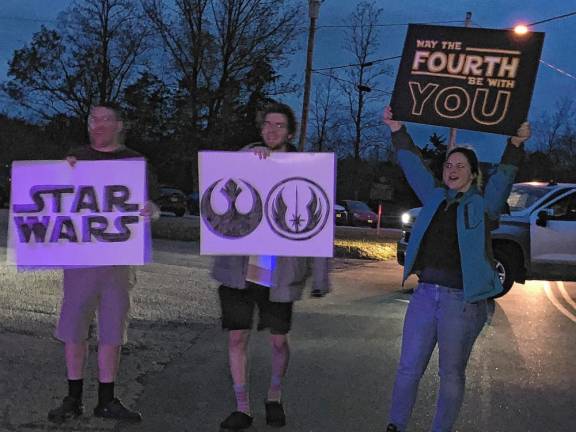 Residents cheer on the runners.