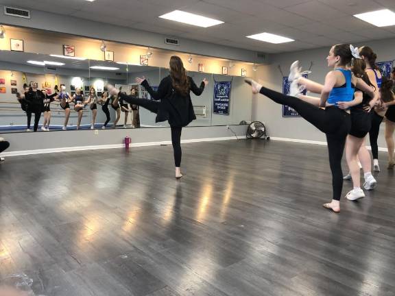 The girls learn choreography during the auditions.