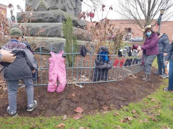 Scouts warm the community with Dress the Fence project