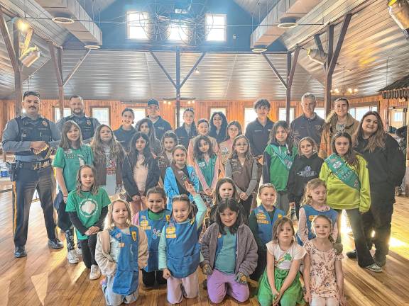 First-responders pose with Girl Scouts from Andover, Green Township and Newton.